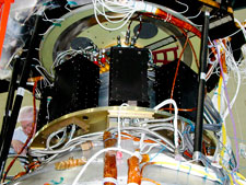 Four GSS control boxes mounted in the Forward Equipment Enclosure (FEE) on the spacecraft frame.