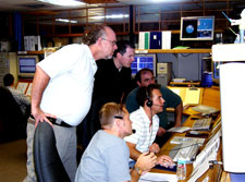 The GP-B Mission Operations team communicates with a NASA ground tracking station following helium depletion in the dewar.