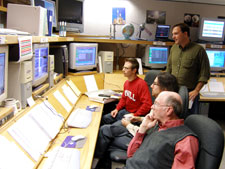 GP-B team members monitor the progress ofinstrument calibration procedures.