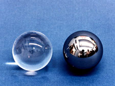 Two GP-B gyro rotorsï¿½uncoated fused quartz (left) and coated with niobium (right).